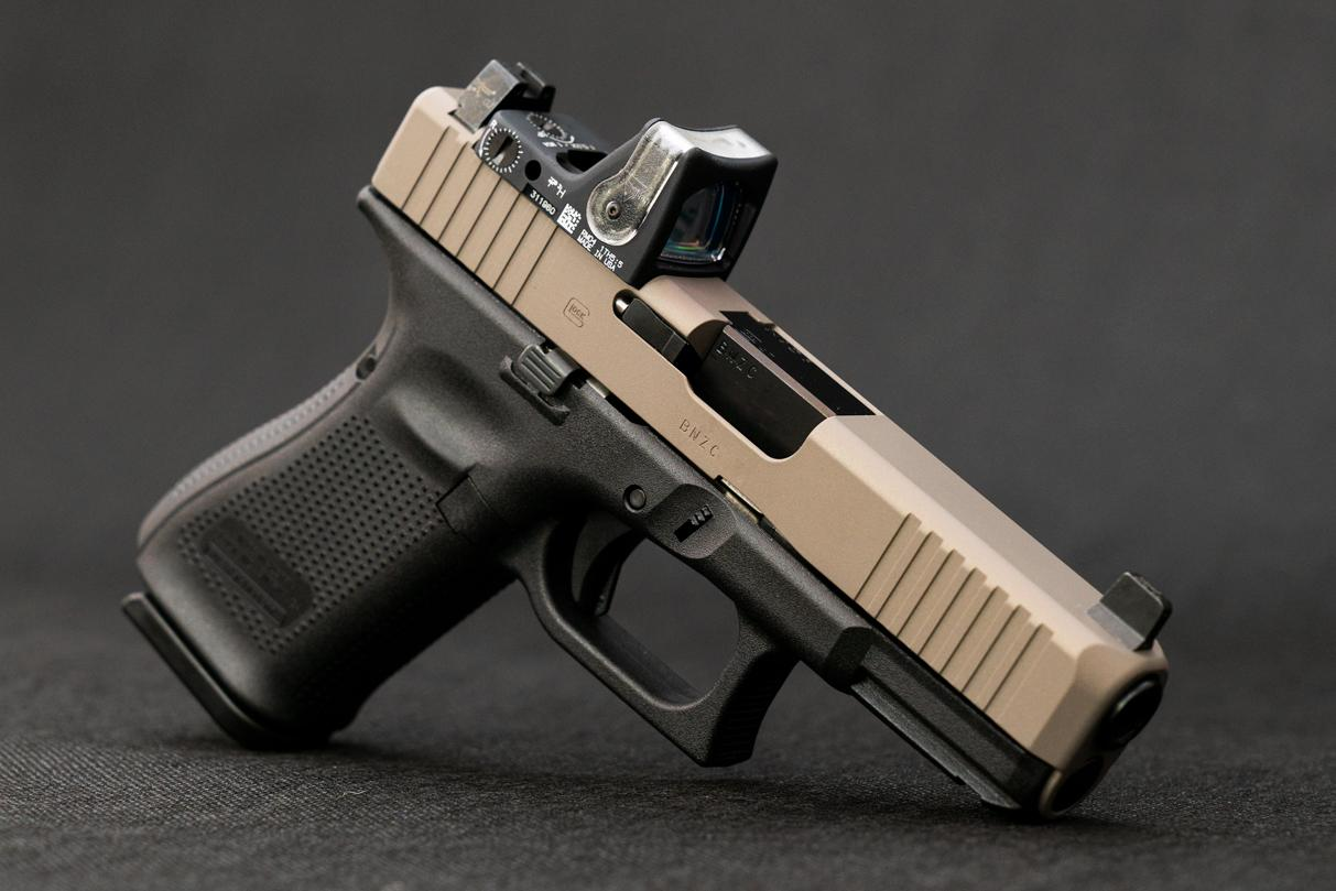 FDE Glock pistol with red dot optic